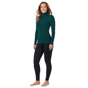 A lady wearing dk pine/navy stripe long sleeve turtleneck softwear with stretch top.