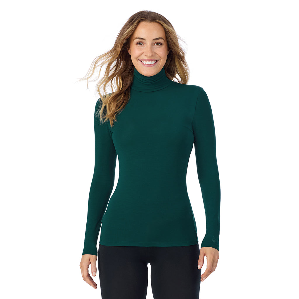 A lady wearing dark pine long sleeve turtleneck softwear with stretch top.