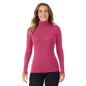 A lady wearing very berry long sleeve turtleneck softwear with stretch top.