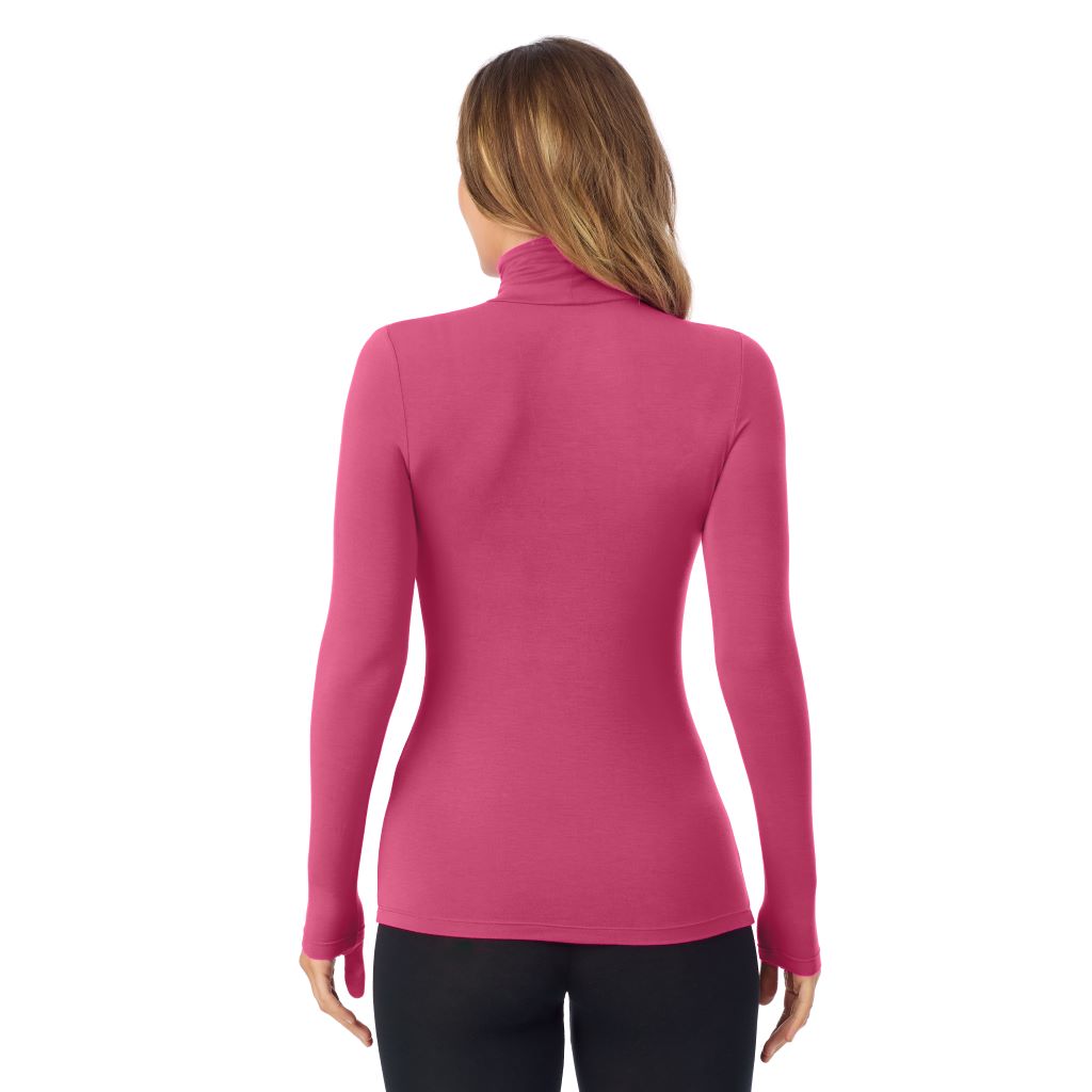 A lady wearing very berry long sleeve turtleneck softwear with stretch top.
