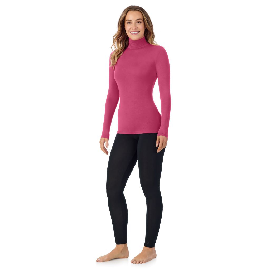 A lady wearing very berry long sleeve turtleneck softwear with stretch top.