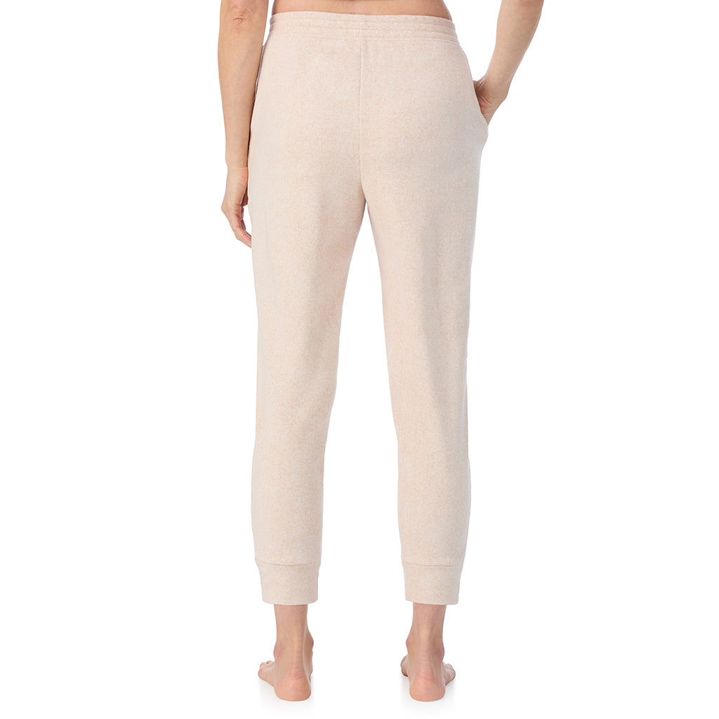 Oatmeal Heather; Model is wearing size S. She is 5'11", Bust 33", Waist 24", Hips 34".@A lady wearing Oatmeal Heather Cuddl Duds x Jennifer Lake Fleecewear with Stretch Cropped Jogger 