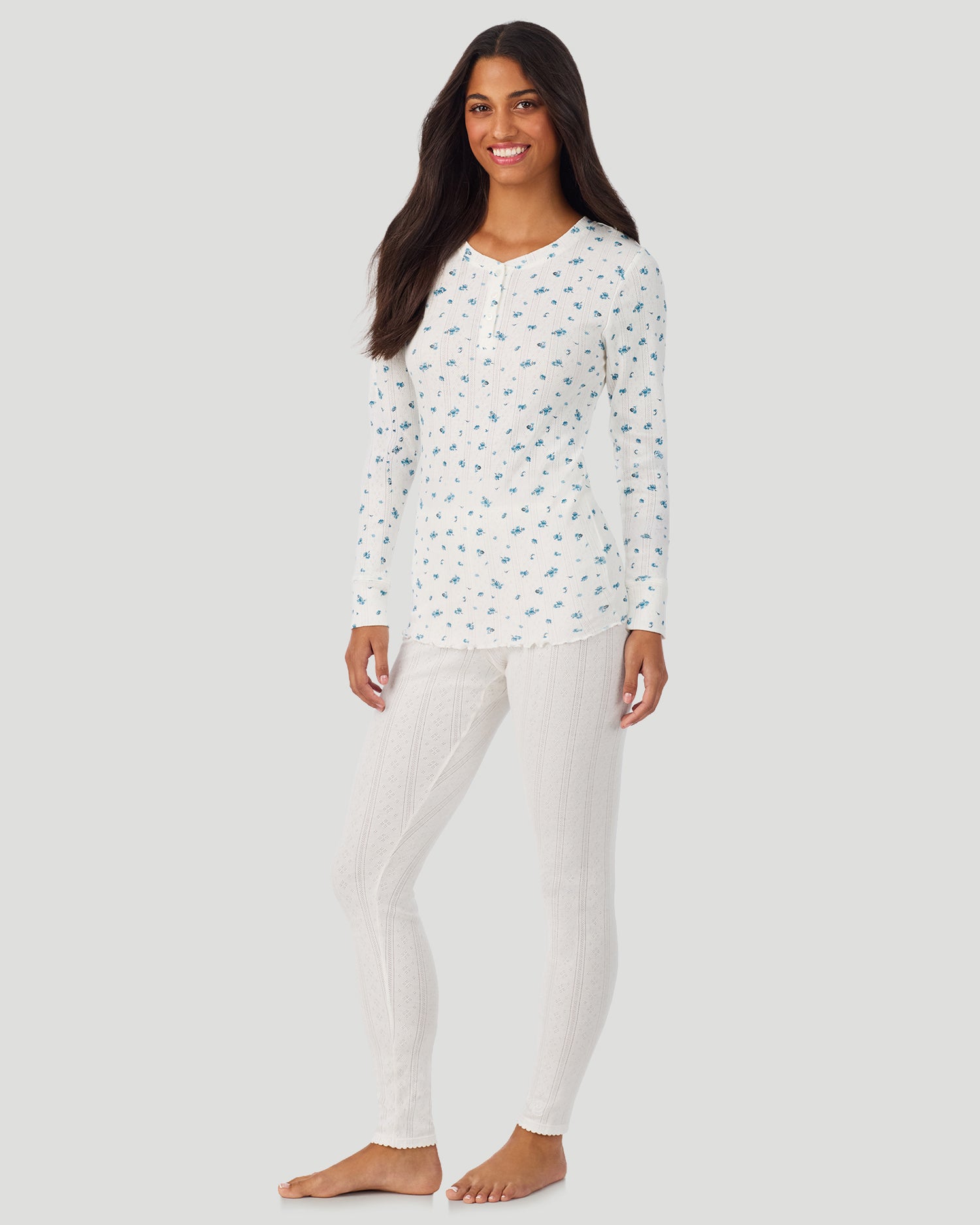 A lady is wearing Blue Ditsy Cotton Pointelle Long Sleeve Henley in a front view standing look