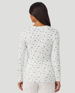 A lady is wearing Blue Ditsy Cotton Pointelle Long Sleeve Henley in a back view look