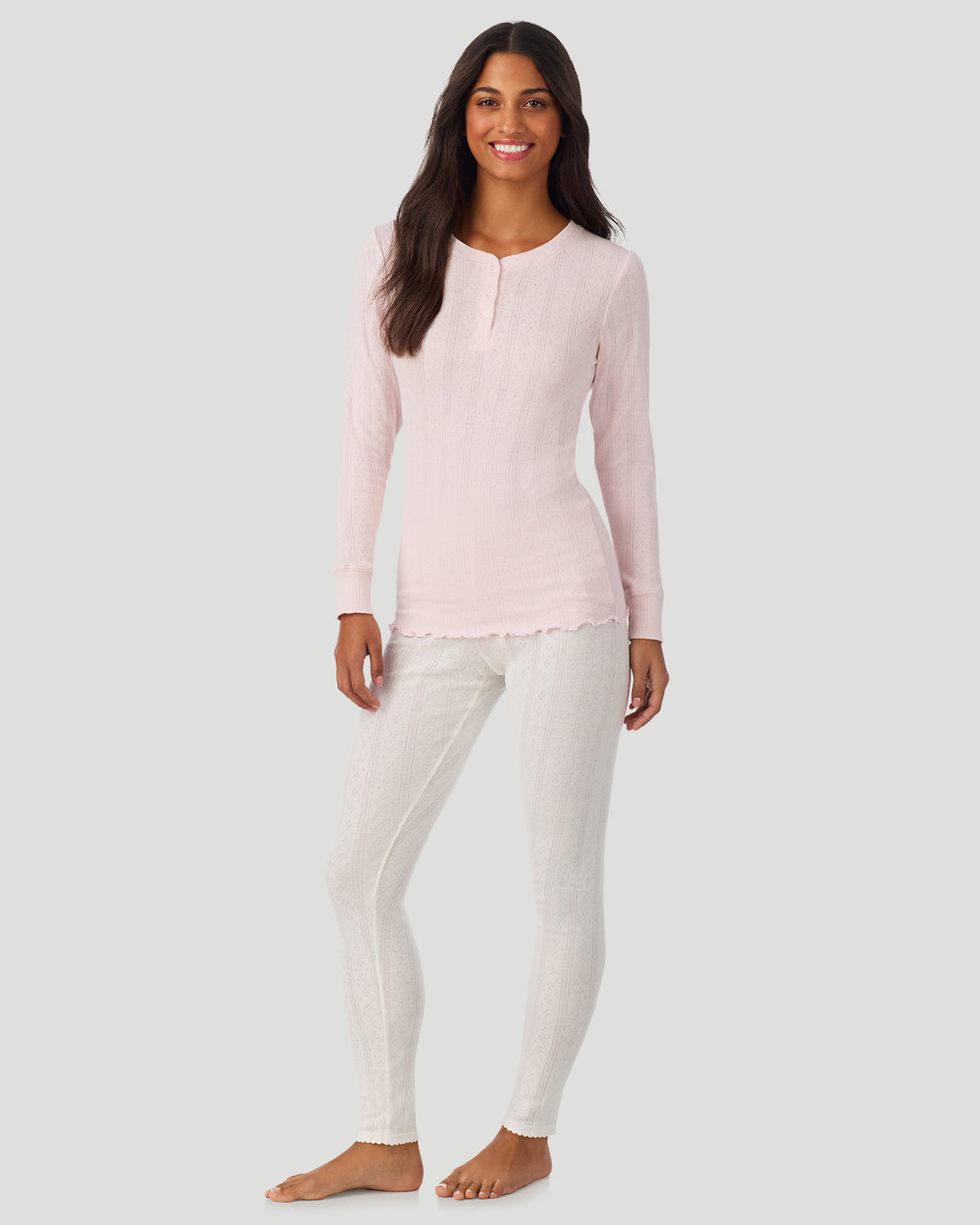 Pretty Rose; Model is wearing a size S. She is 5’7”, Bust 32”, Waist 25”, Hips 34”. @A lady is wearing Pretty Rose Cotton Pointelle Long Sleeve Henley in a front view standing look