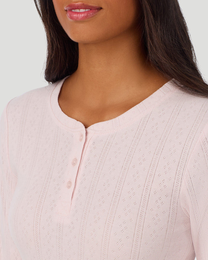 A lady is wearing Pretty Rose Cotton Pointelle Long Sleeve Henley in a front view detail close up look