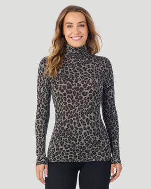 A lady wearing charcoal leopard Softwear With Stretch Long Sleeve Turtleneck top in a front pose
