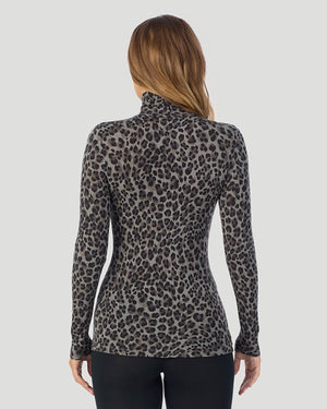 A lady wearing charcoal leopard Softwear With Stretch Long Sleeve Turtleneck top in a back pose