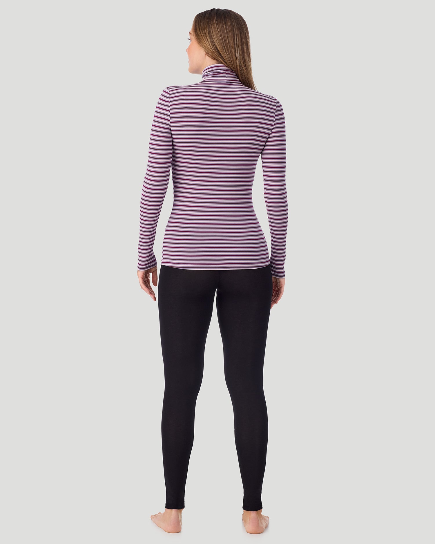 A lady wearing Lilac Stripe Softwear With Stretch Long Sleeve Turtleneck top in a back pose
