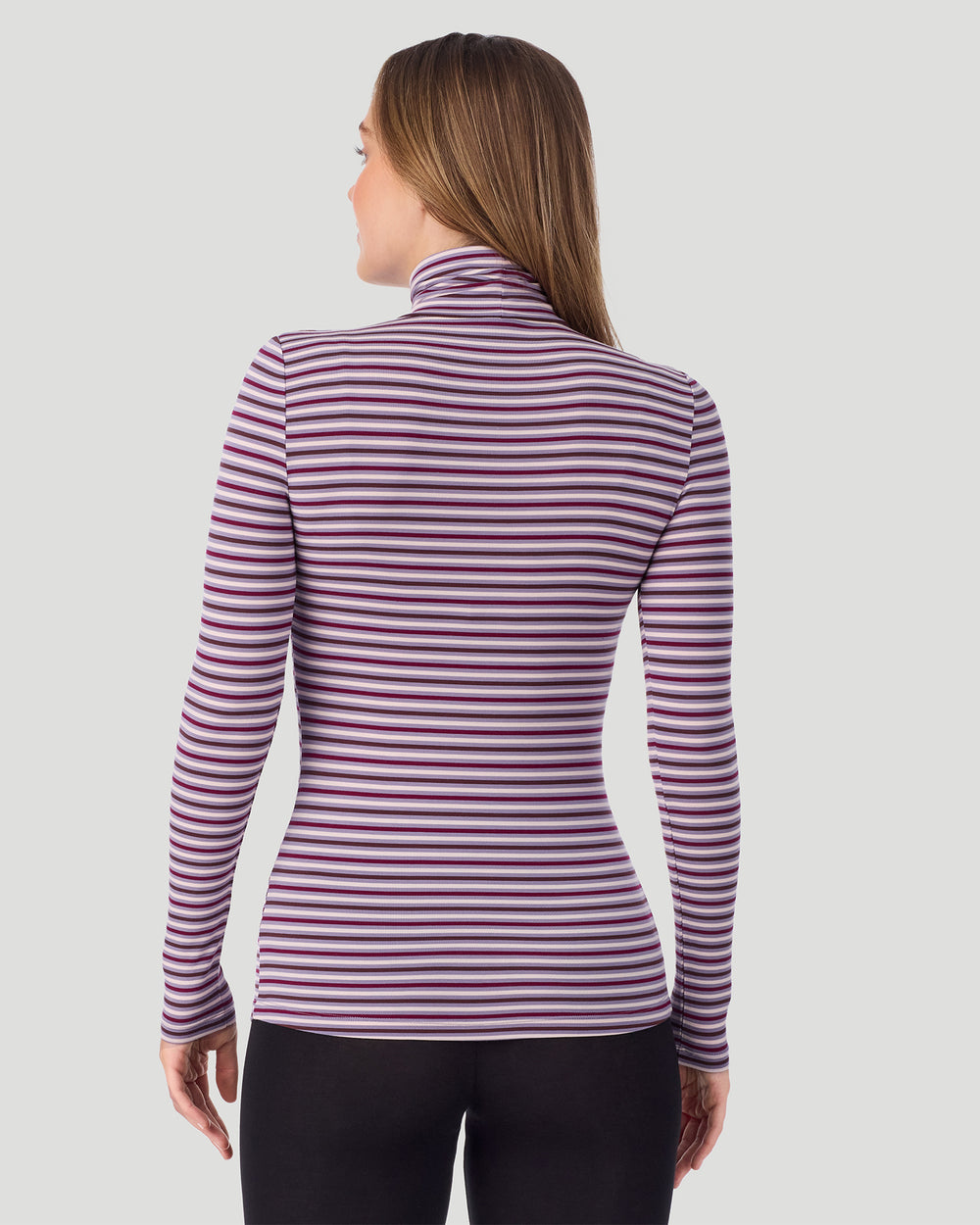 A lady wearing Lilac Stripe Softwear With Stretch Long Sleeve Turtleneck top in a back pose