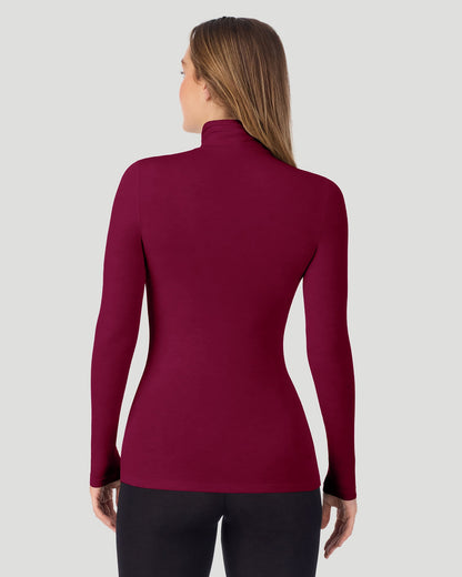 A lady wearing Scarlet Softwear With Stretch Long Sleeve Turtleneck top in a back pose