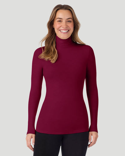 A lady wearing Scarlet Softwear With Stretch Long Sleeve Turtleneck top in a front pose