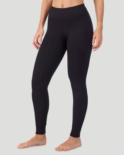  A lady wearing Cozy Cable Legging in black posing front view side angled pose