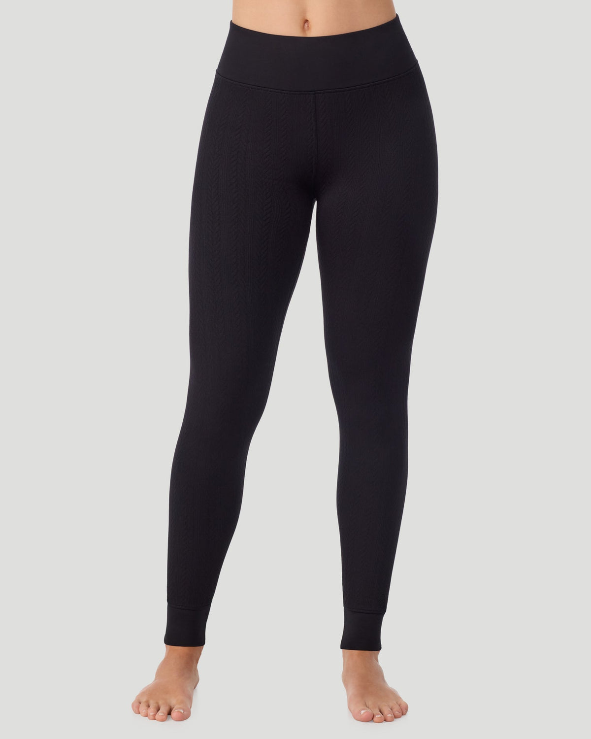 Black; Model is wearing a size S. She is 5’11.5”, Bust 34”, Waist 27”, Hips 38.5”. @ A lady wearing Cozy Cable Legging in black posing front view standing shot