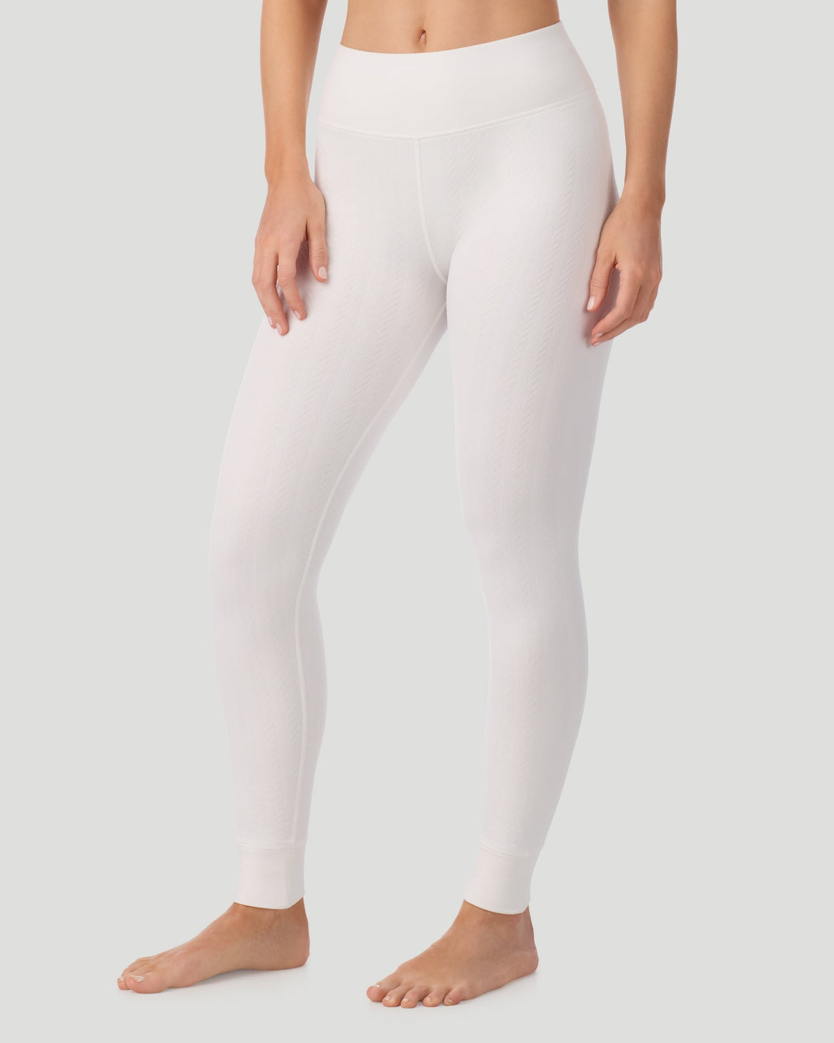  A lady wearing Cozy Cable Legging in ivory posing front view side angled pose