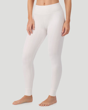 A lady wearing Cozy Cable Legging in ivory posing front view side angled pose