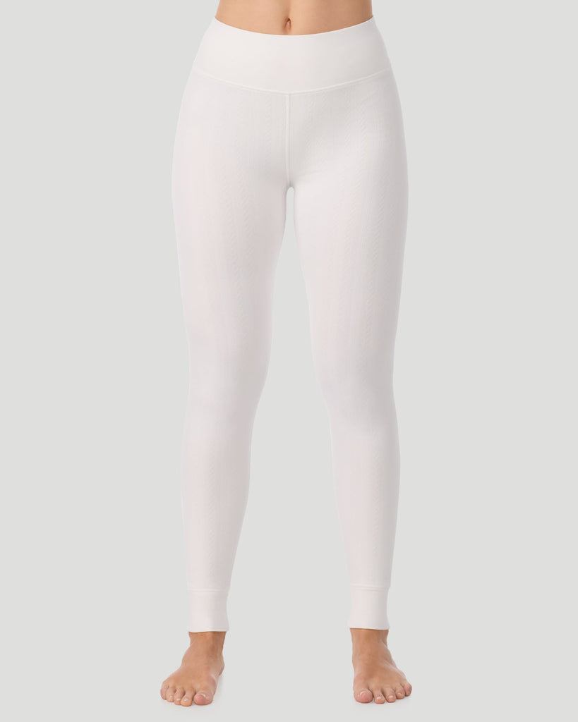  A lady wearing Cozy Cable Legging in ivory posing front view standing shot