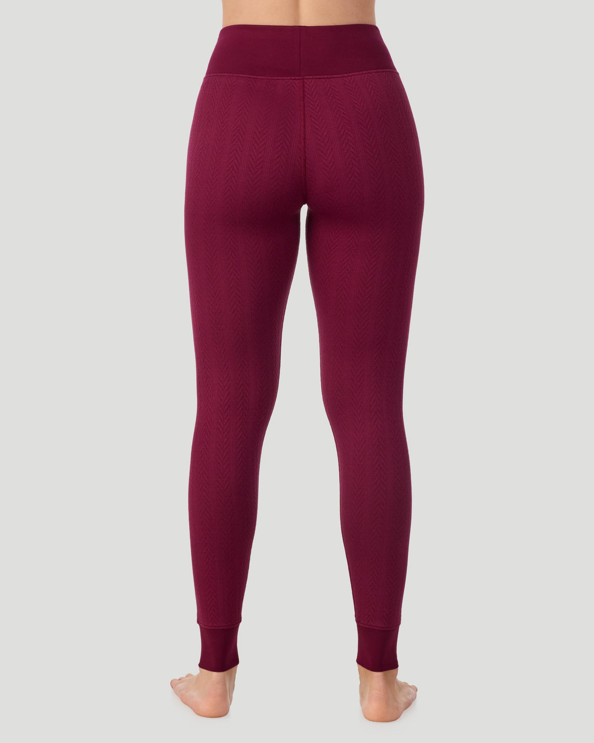  A lady wearing Cozy Cable Legging in bordeaux posing back view standing shot