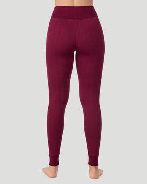  A lady wearing Cozy Cable Legging in bordeaux posing back view standing shot