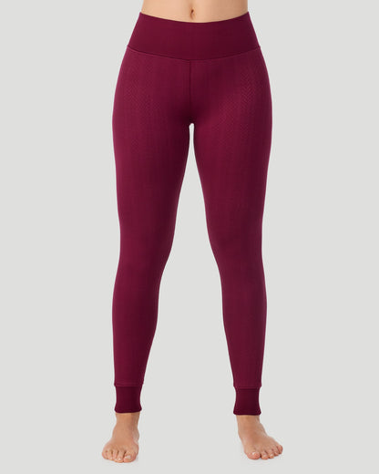  A lady wearing Cozy Cable Legging in bordeaux posing front view standing shot