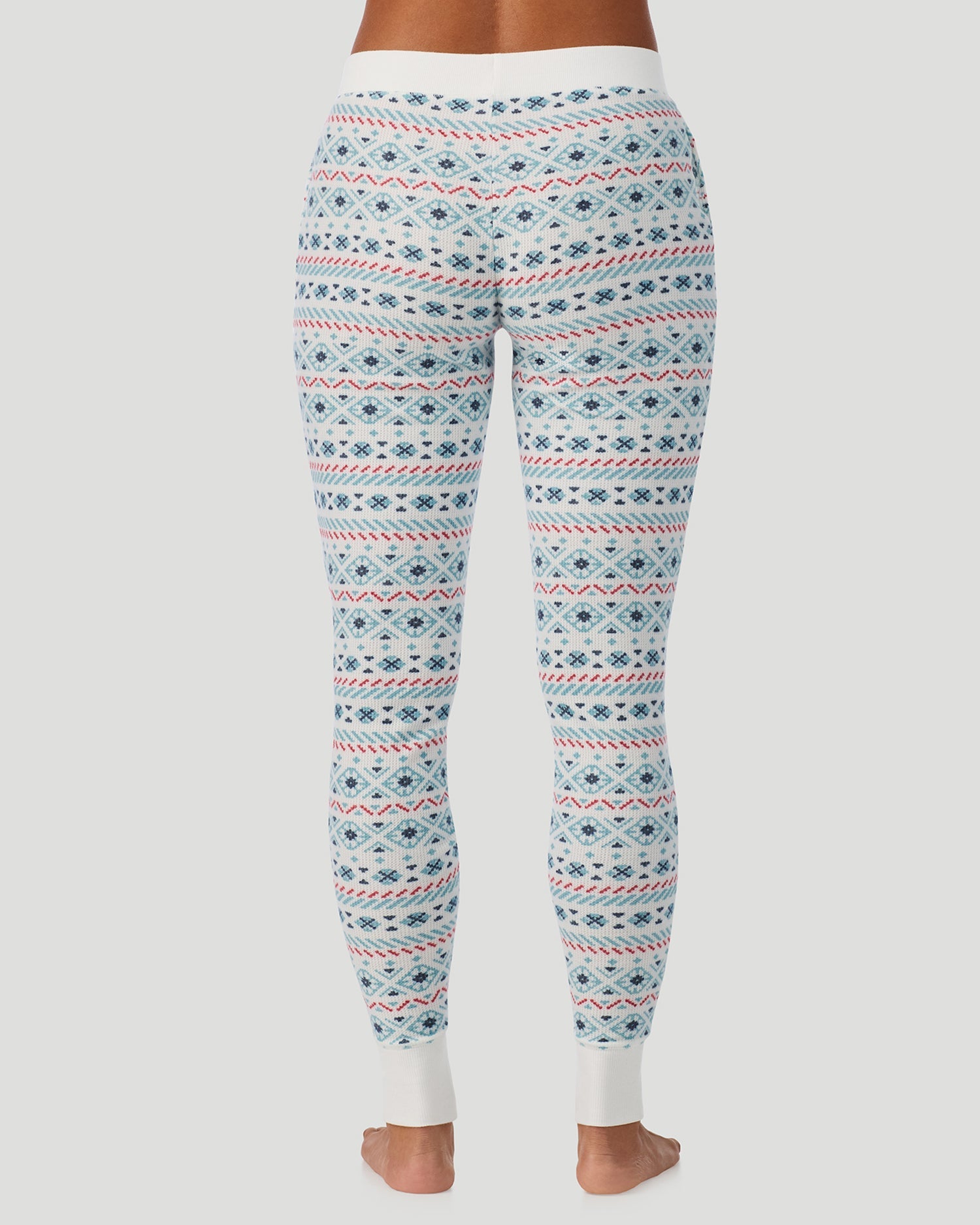 A lady wearing Cozy Stretch Thermal Legging in Ivory /Blue Fairisle