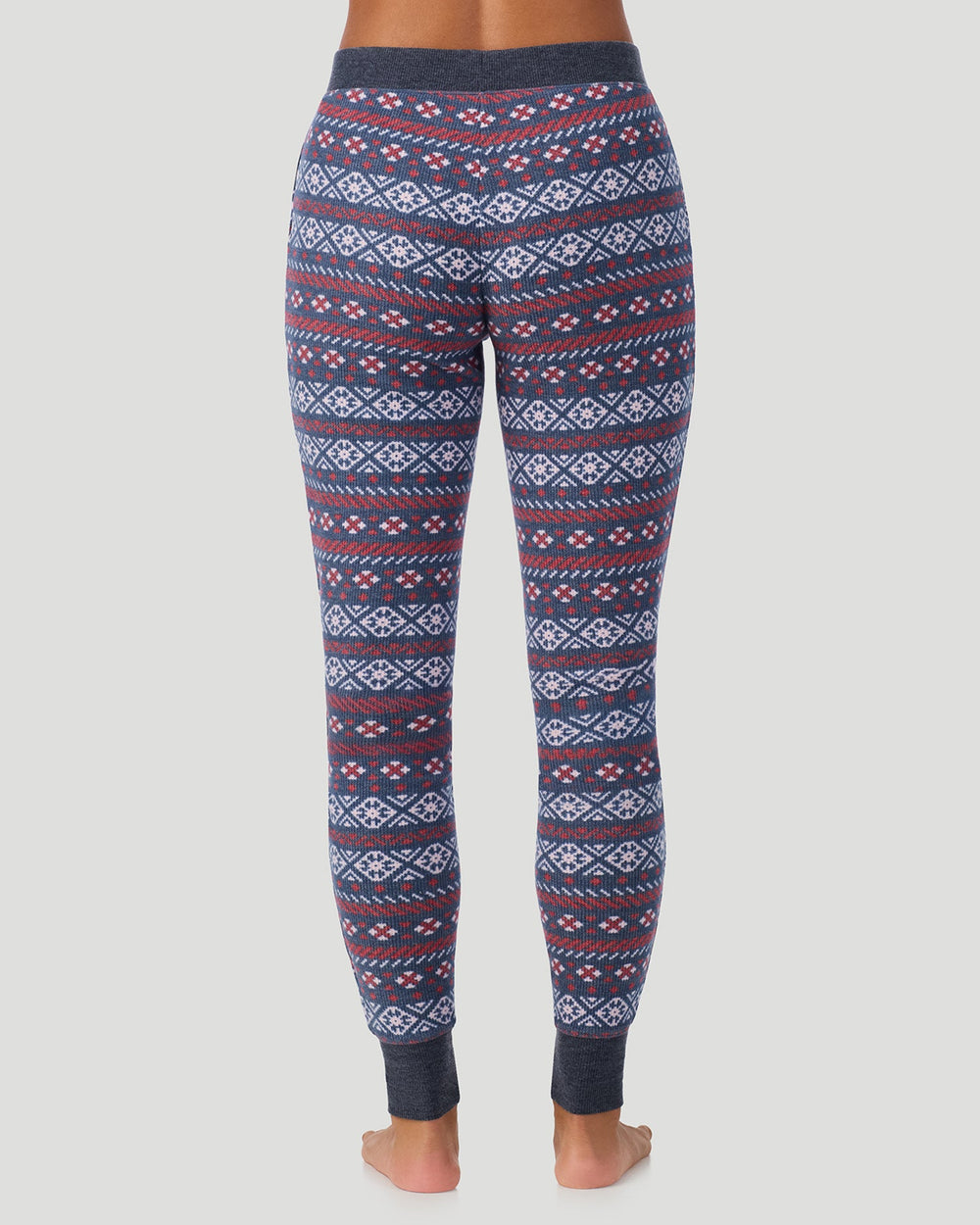 A lady wearing Medieval Blue Fairisle Cozy Stretch Thermal Legging in a back view pose