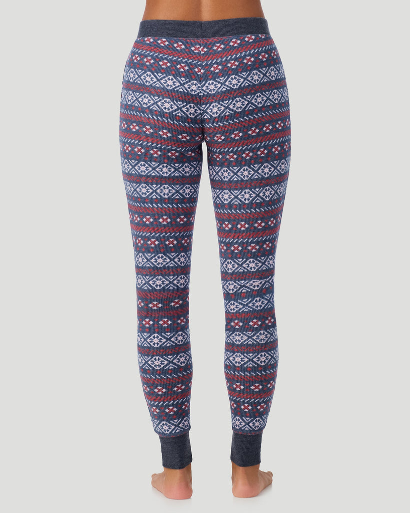  A lady wearing Medieval Blue Fairisle Cozy Stretch Thermal Legging in a back view pose