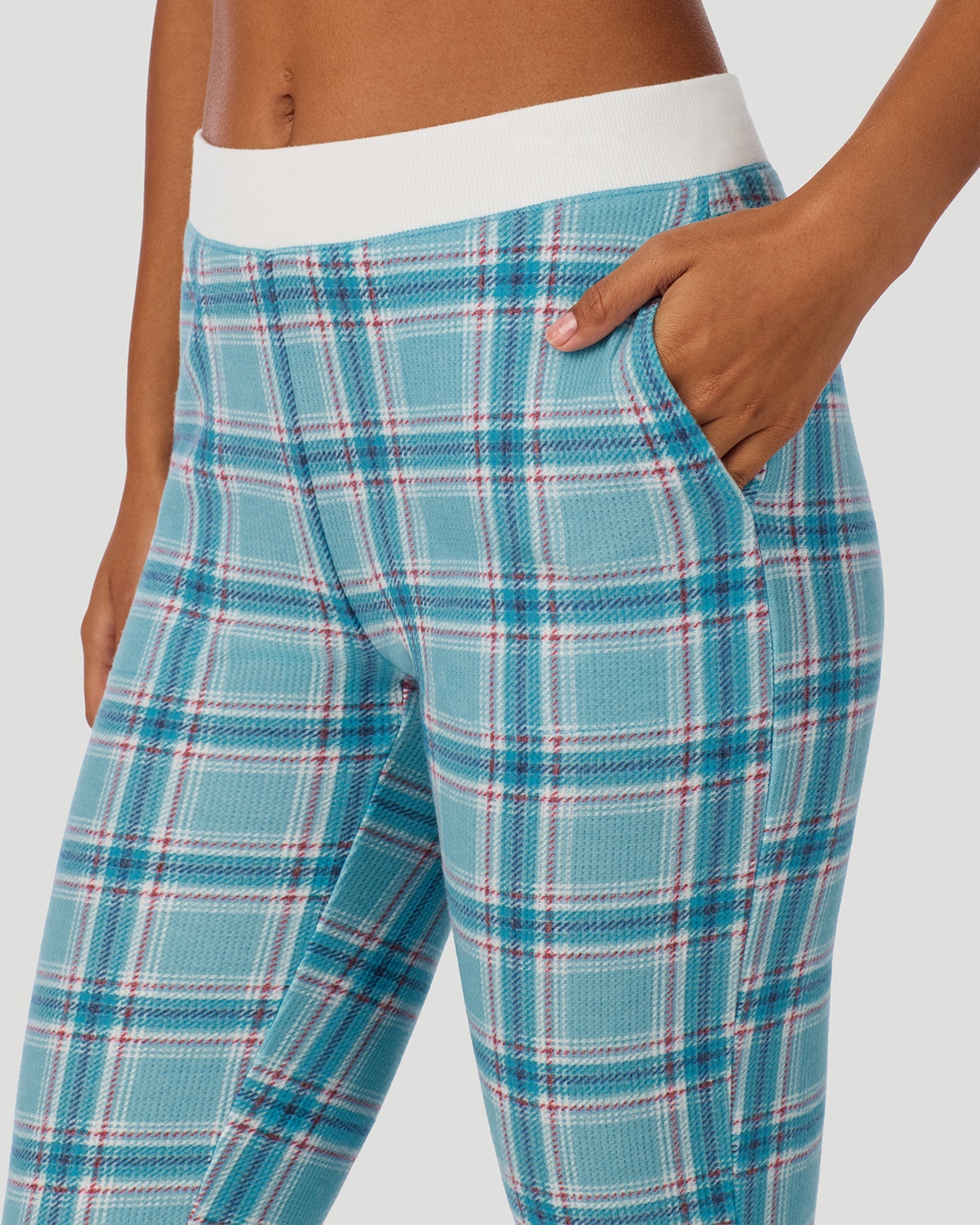 A lady wearing Cozy Stretch Thermal Legging in Cadet Blue Plaid