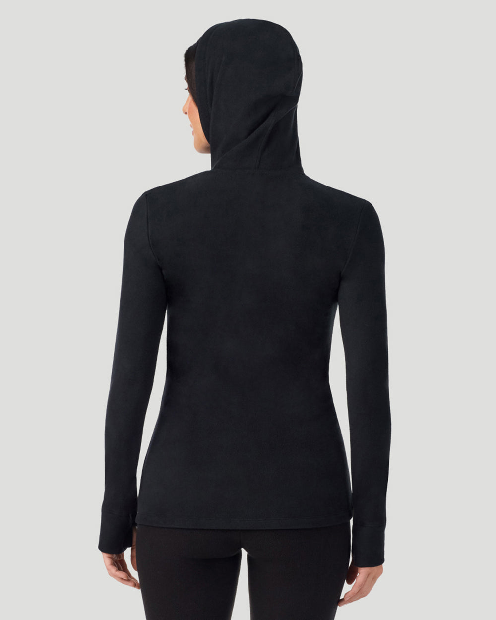 A lady wearing Black half zip hoodie back view arms relaxed