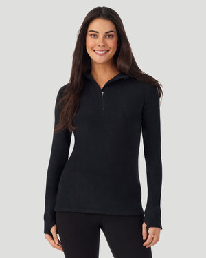  A lady wearing Black half zip hoodie smiling arms relaxed