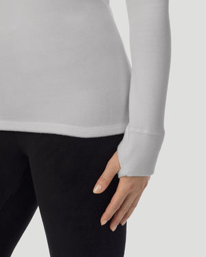  A lady wearing Light Grey Heather half zip hoodie thumbhole cuff detail