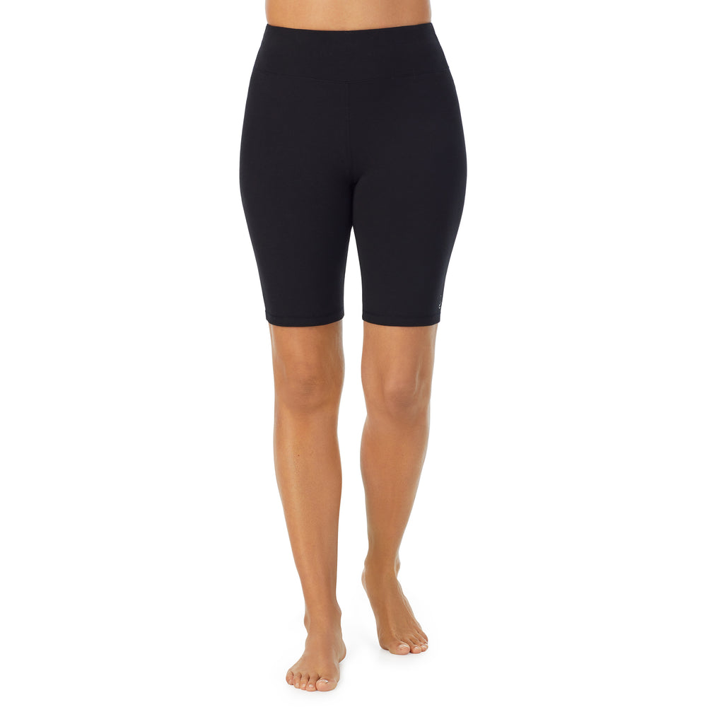 A lady wearing black cottonwear short.
