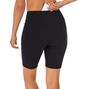 A lady wearing black cottonwear short.