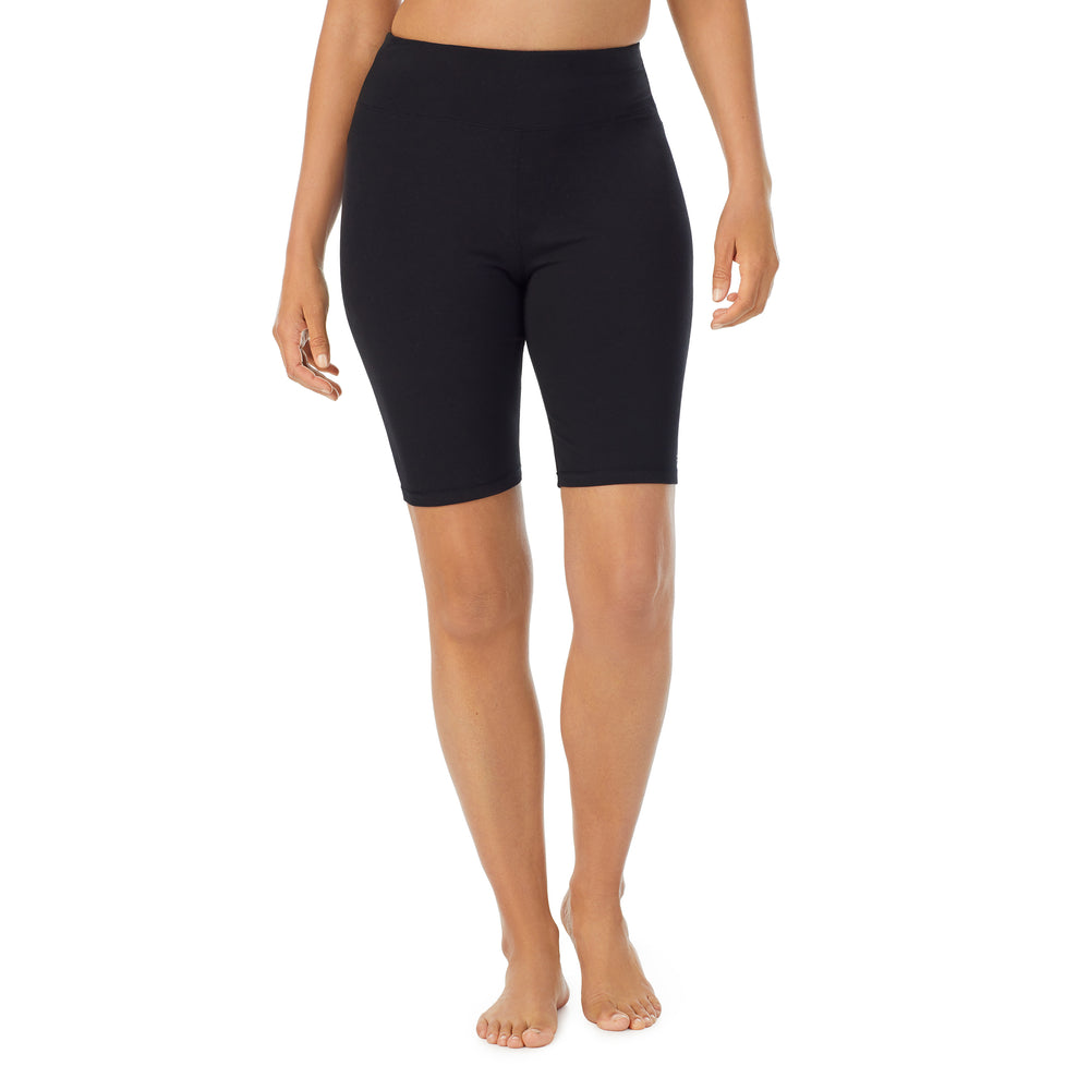 A lady wearing black cottonwear short.