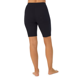 A lady wearing black cottonwear short.