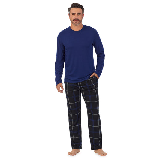 Black Check;Model is wearing size M. He is 6'2", Waist 32", Inseam 34".@A man wearing Blue Mens Classic Long Sleeve Crew and black check Pajama Pant 2-pc Set