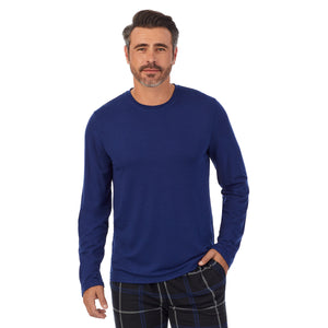 A man wearing Blue Mens Classic Long Sleeve Crew and black check Pajama Pant 2-pc Set