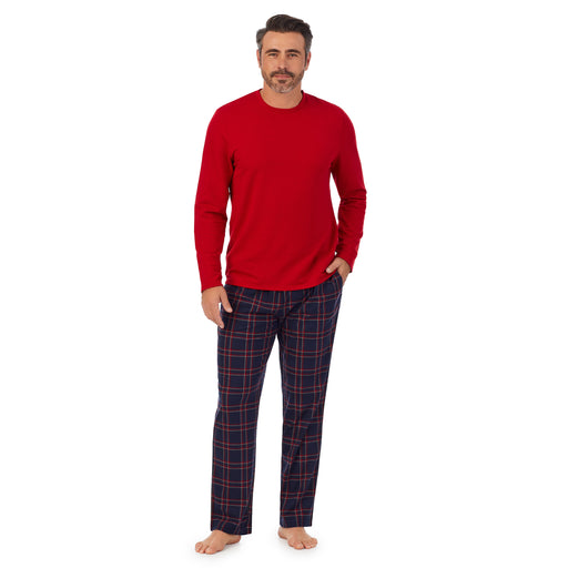A man wearing Red Mens Cozy Lodge Long Sleeve Crew and navy plaid Pajama Pant 2-pc Set 