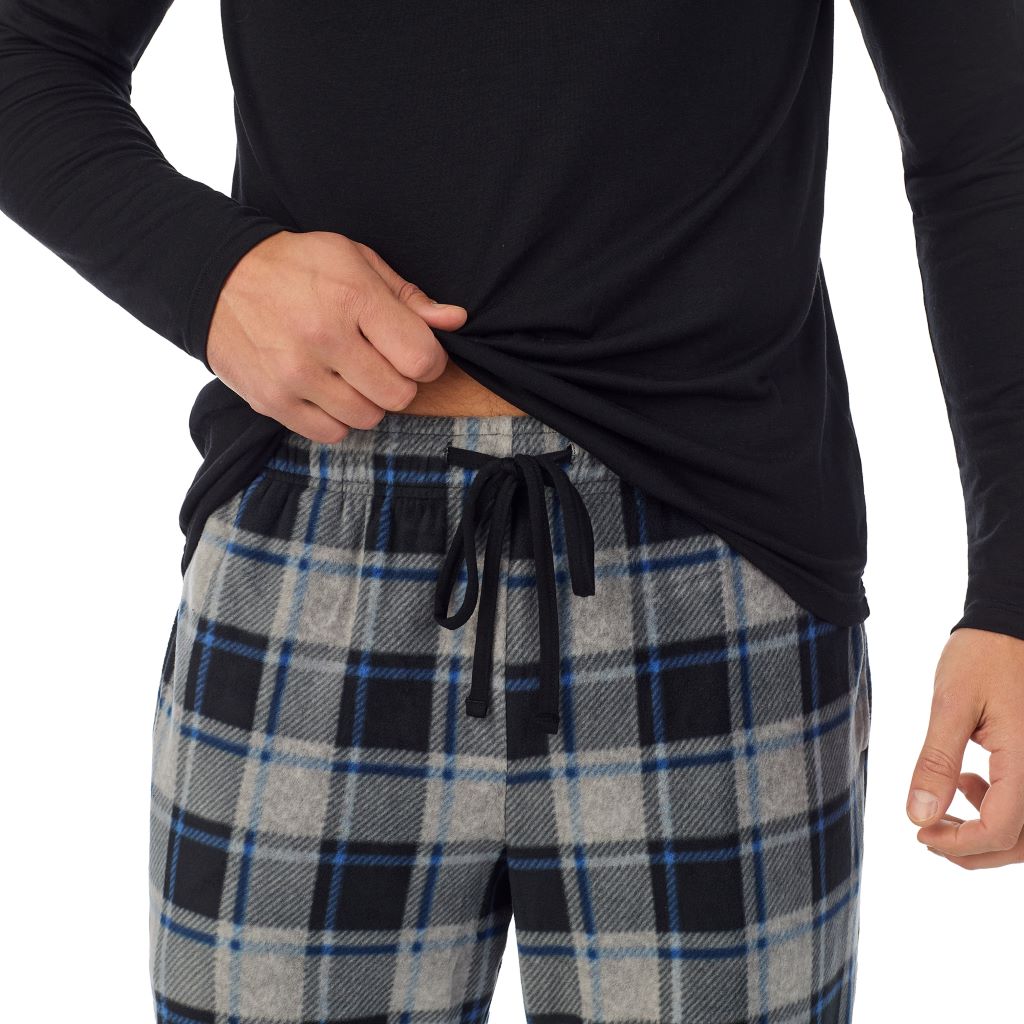 Grey Plaid; Model is wearing a size M. He is 6’2”, Waist is 32”, Inseam 34” @A Man is wearing Grey Plaid Mens Cabin Fleece Long Sleeve Crew and Pajama Pant 2-Pc Set