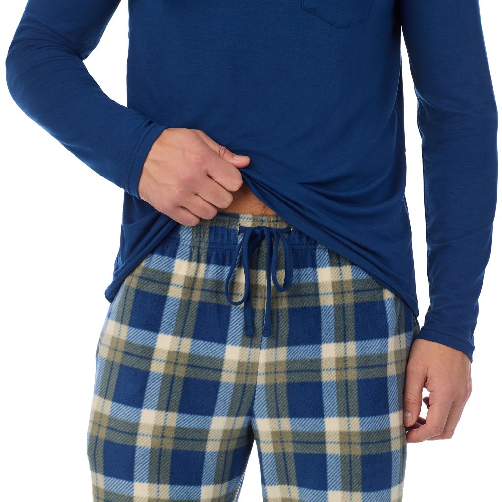 Blue Plaid; Model is wearing a size M. He is 6’2”, Waist is 32”, Inseam 34” @A Man is wearing Blue Plaid Mens Cabin Fleece Long Sleeve Crew and Pajama Pant 2-Pc Set