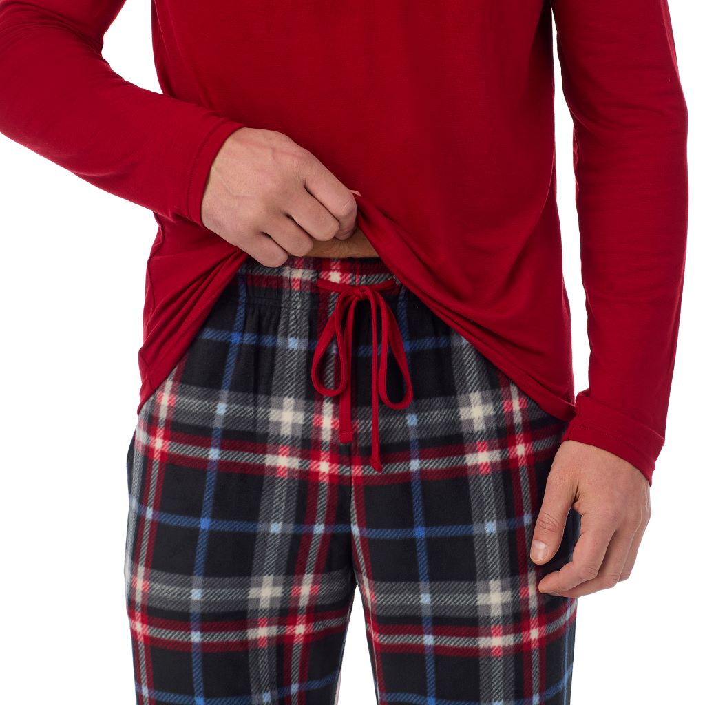 A Man is wearing Black Multi Plaid Mens Cabin Fleece Long Sleeve Crew and Pajama Pant 2-Pc Set