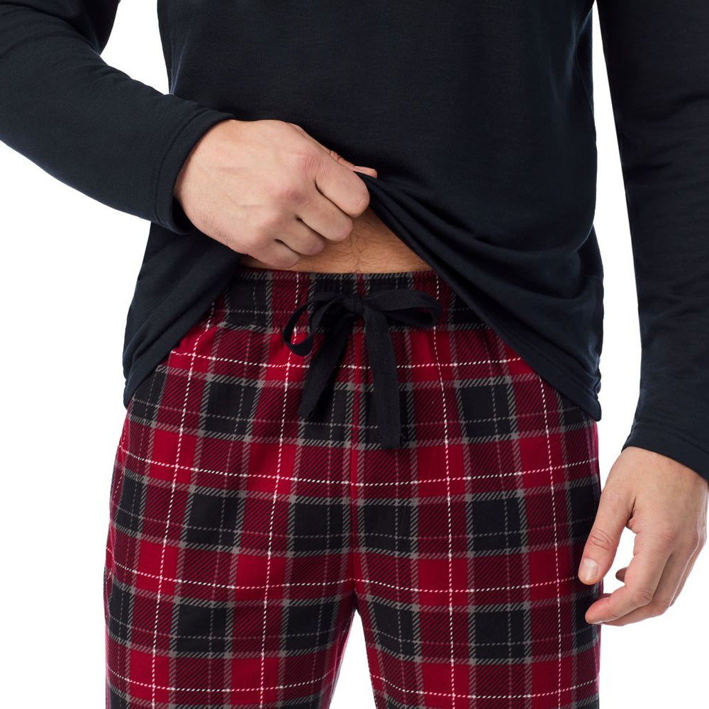 A man wearing 
Cozy Lodge Long Sleeve Crew and Pajama Pant 2-Pc Set