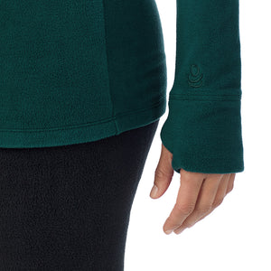  A Lady is wearing Dark Pine Fleecewear With Stretch Long Sleeve Half Zip Hoodie !94% Recycled Polyester, 6% Spandex!