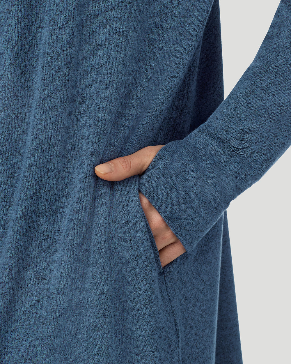 A lady wearing Deep Chambray SoftKnit Wrap in a front view detail close up look