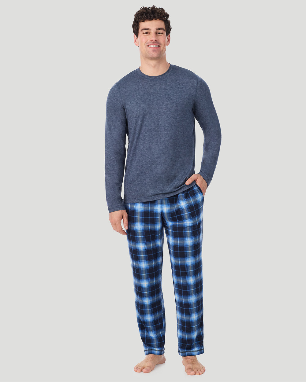 A Man is wearing Navy Spacedye/Navy Blazer Plaid Mens Classic Long Sleeve Crew and Pajama Pant 2-Pc Set in a front view standing pose