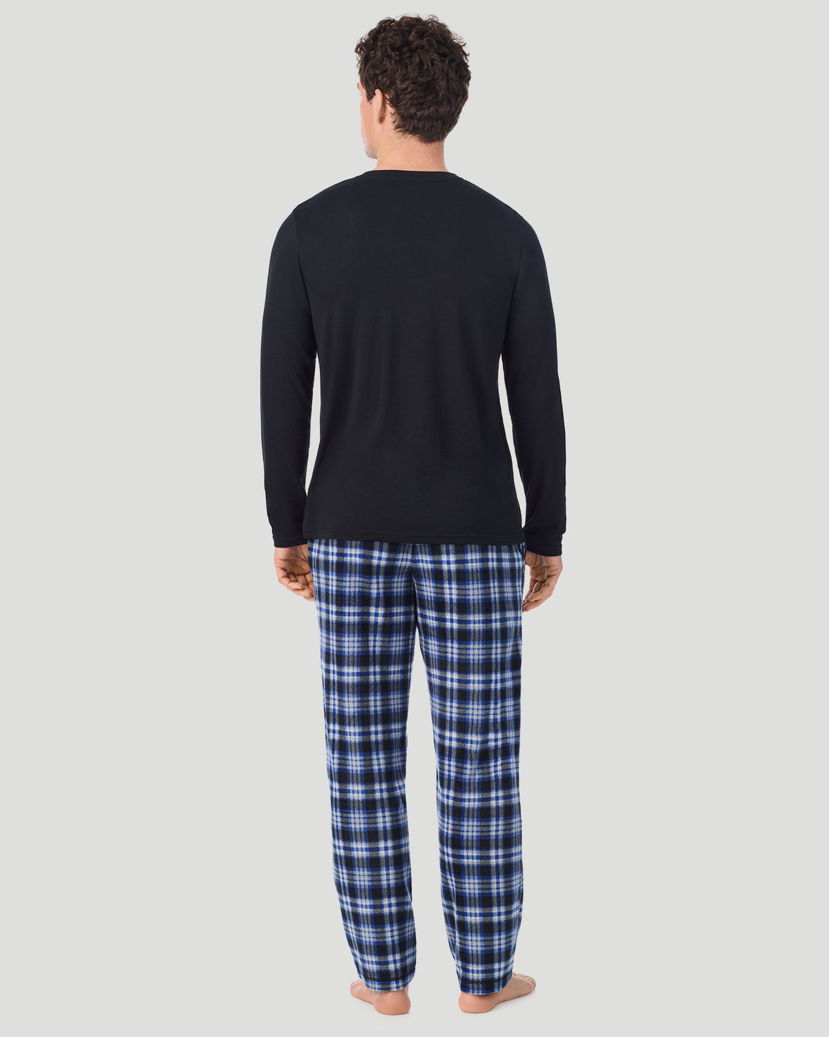 Black/Blue Black Plaid; Model is wearing a size M. He is 6’2”, Waist is 32”, Inseam 32”. @A Man is wearing Black/Blue Black Plaid Mens Cabin Fleece Long Sleeve Crew and Pajama Pant 2-Pc Set in a back view pose