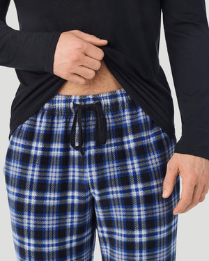 A Man is wearing Black/Blue Black Plaid Mens Cabin Fleece Long Sleeve Crew and Pajama Pant 2-Pc Set in a front view detail close up look