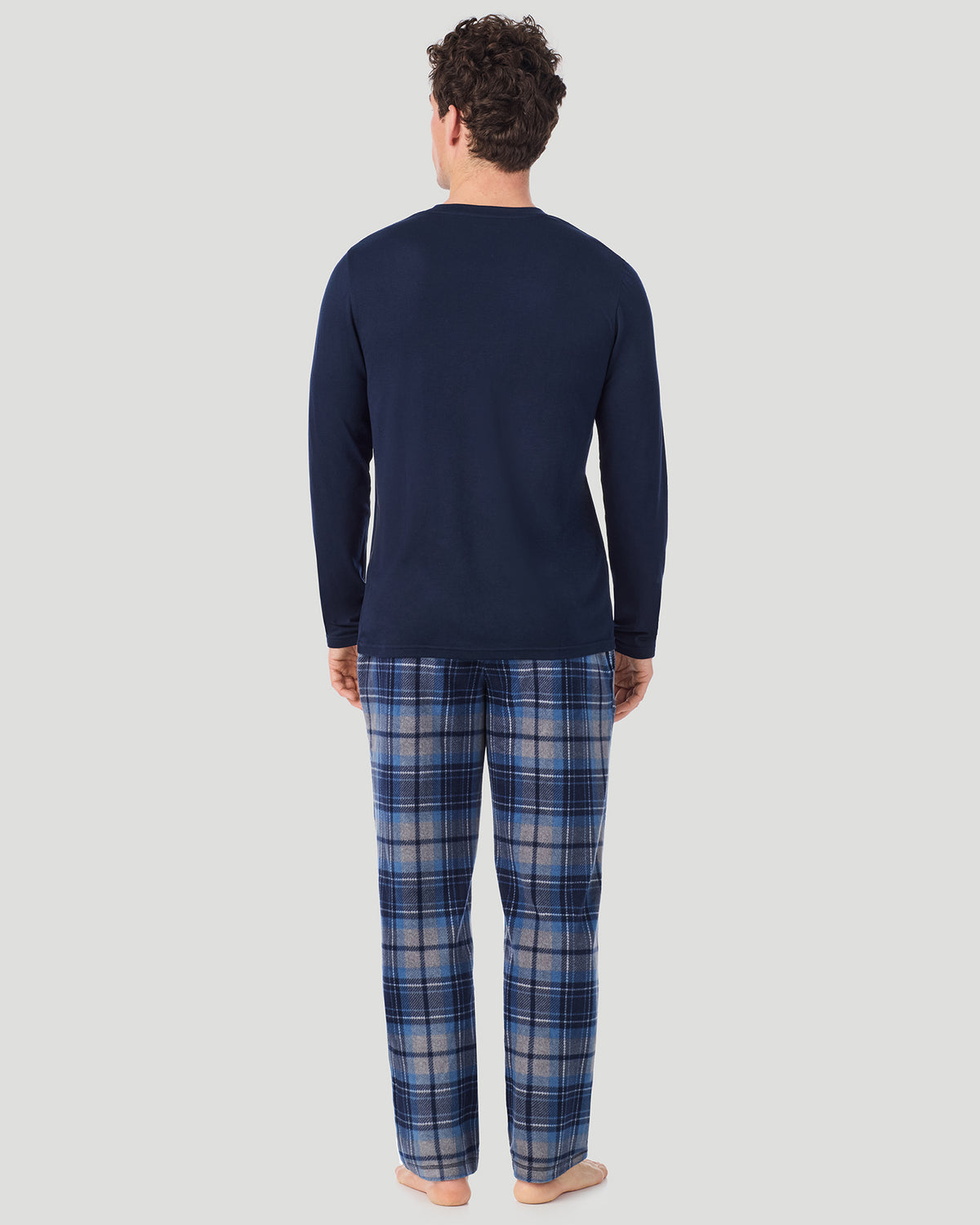 A Man is wearing Blue/Navy Grey Plaid Mens Cabin Fleece Long Sleeve Crew and Pajama Pant 2-Pc Set in a back view pose