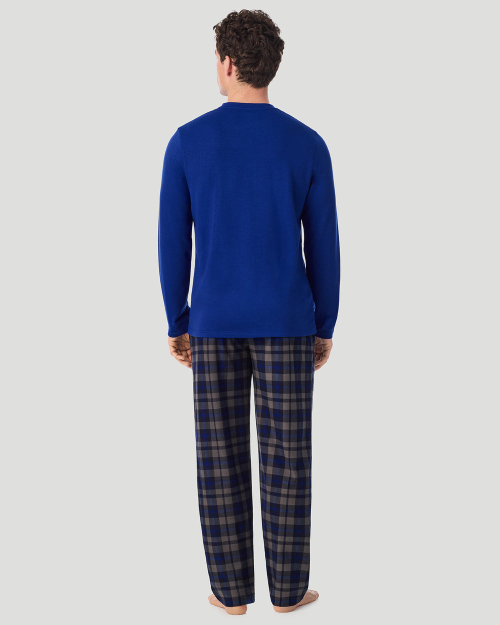 A Man is wearing Blue/Blue Check Mens Cozy Lodge Long Sleeve Crew and Pajama Pant 2-Pc Set in a back view standing pose