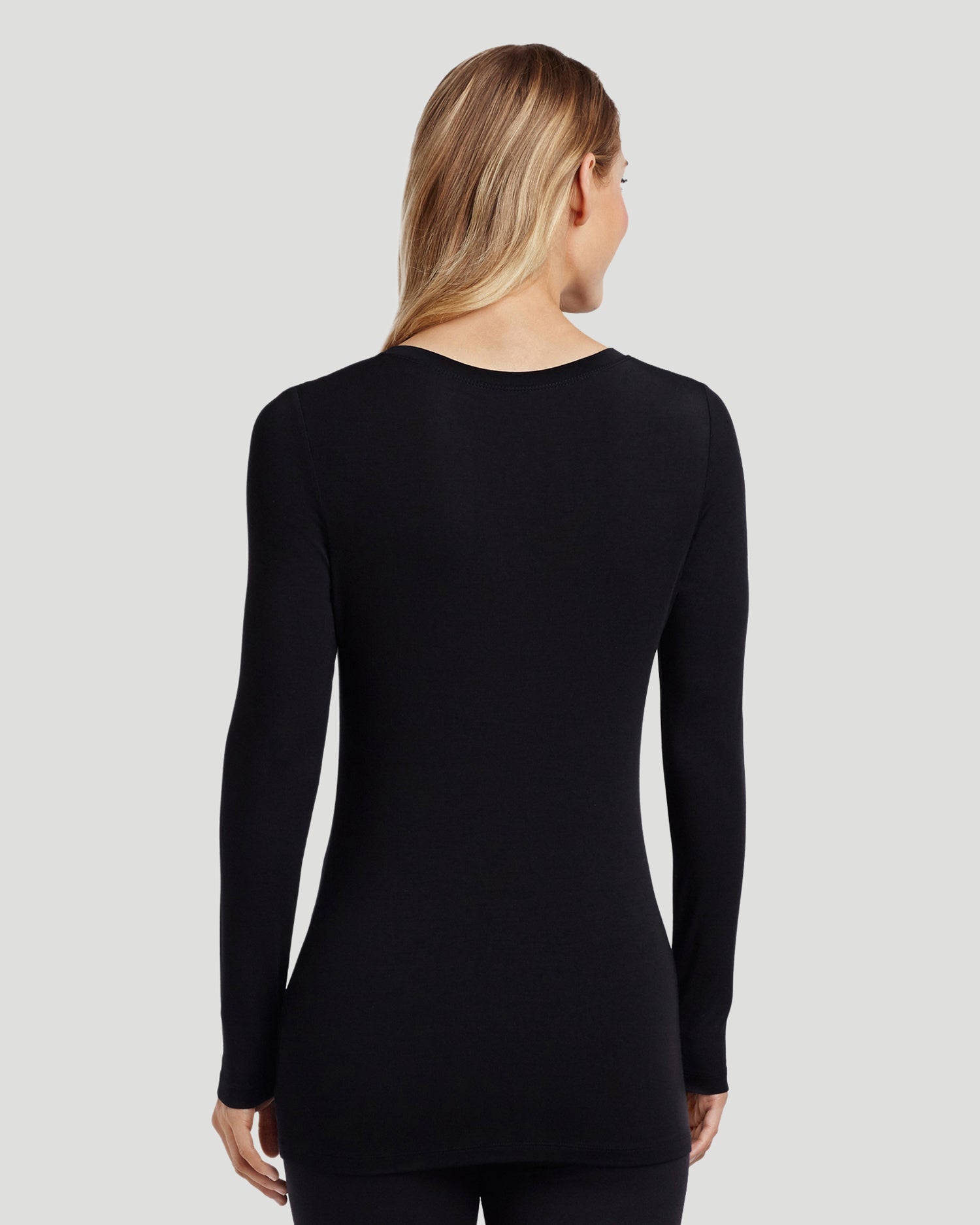 A lady wearing Softwear With Stretch Long Sleeve V-Neck in Black back view back view